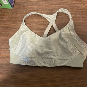 Green and white sports bra